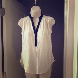 Sleeveless cream and black blouse with v-neck